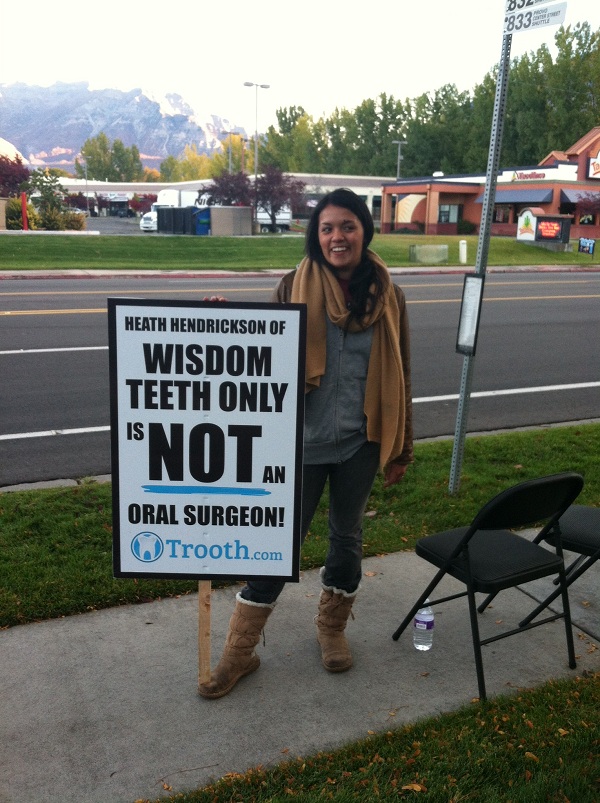 Protester out front of Dr. Wisdom Teeth office