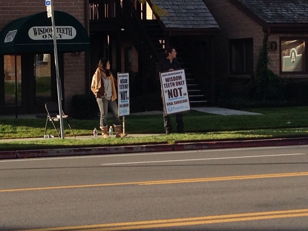 Protesters out in front of Dr. Wisdom Teeth dental office